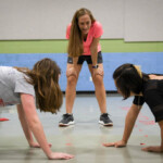 PE Teacher Angela Stark Watches As Marianne Gebb Left And Sofia Wu